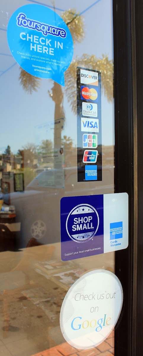 Front door with payment and Shop Small decals at Cali v. Smog